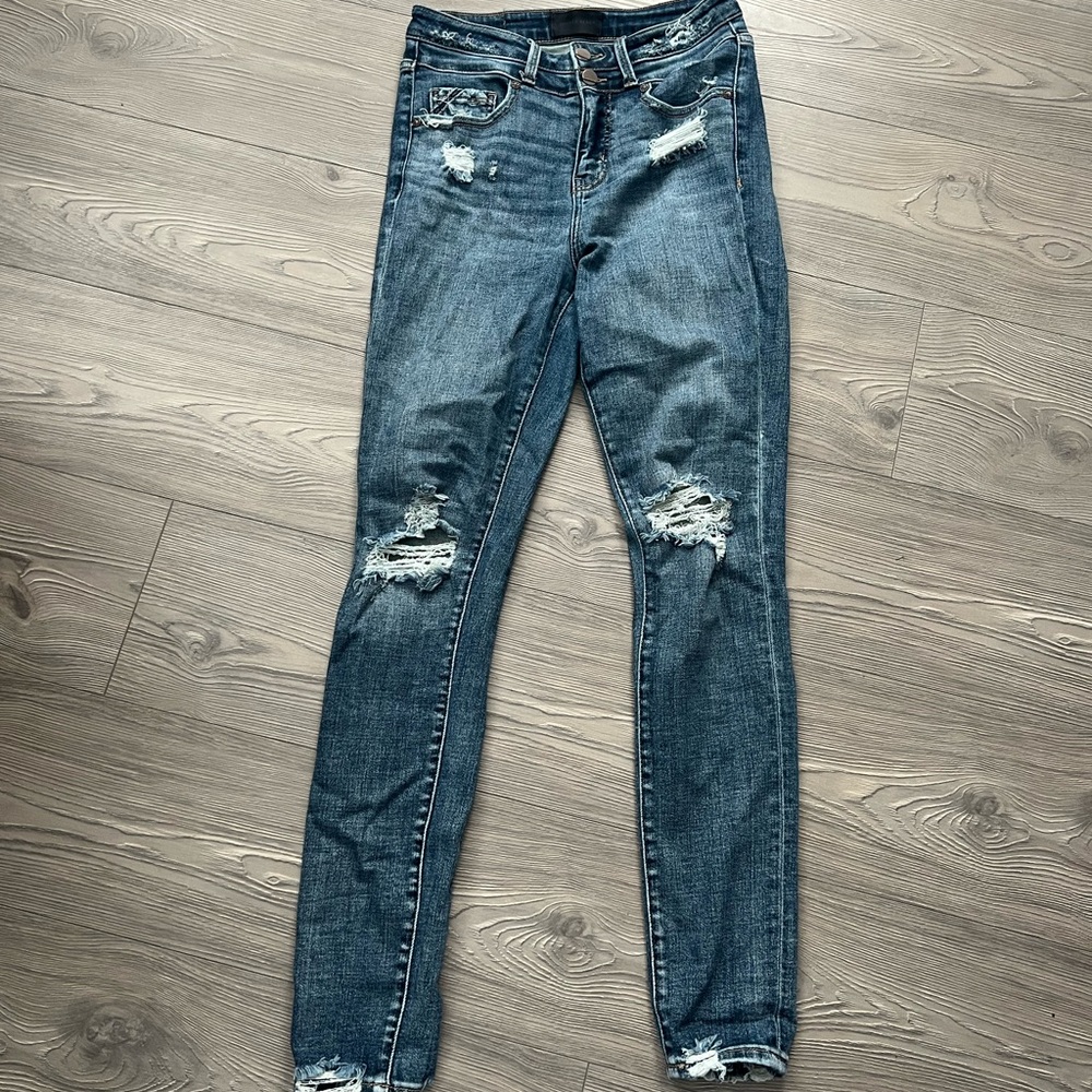 Buckle black skinny jeans